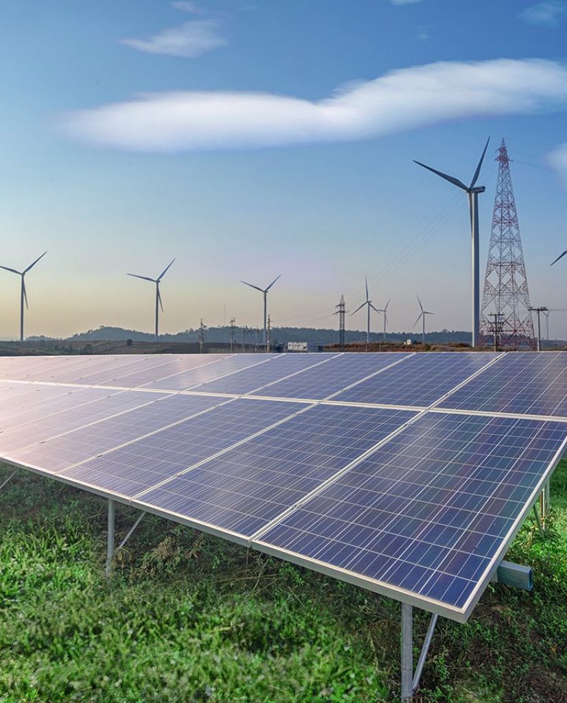 renewable-energy-solar-panels-wind-turbines-green-grass-blue-sky.jpg